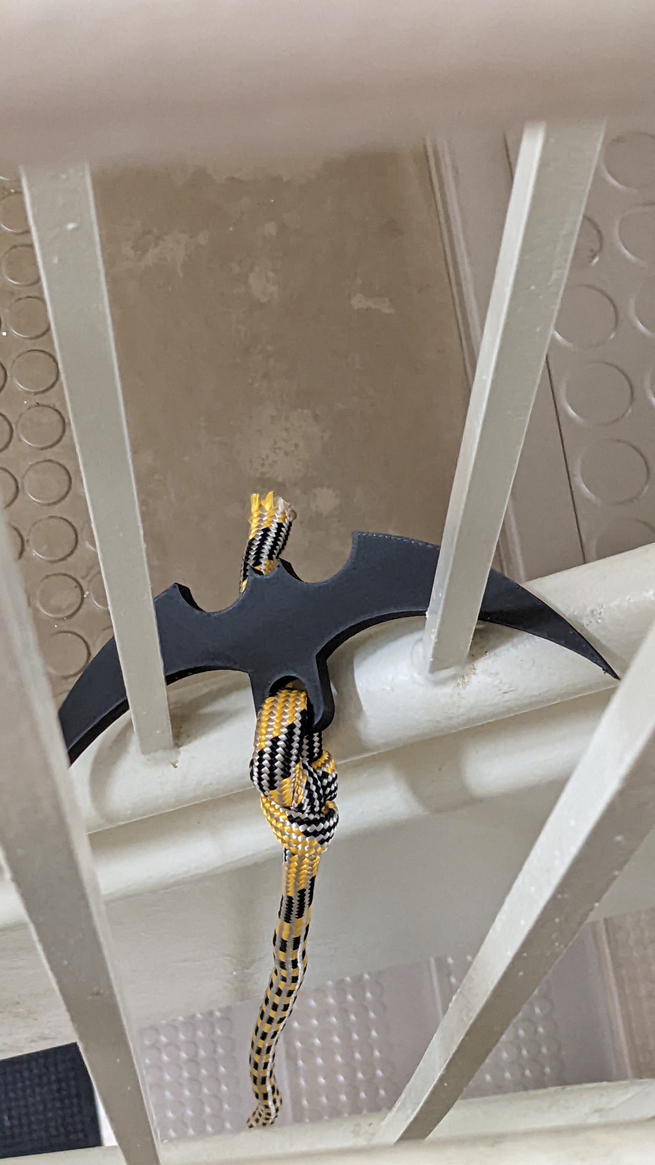 Batman-inspired grappling hook demonstration in stairwell